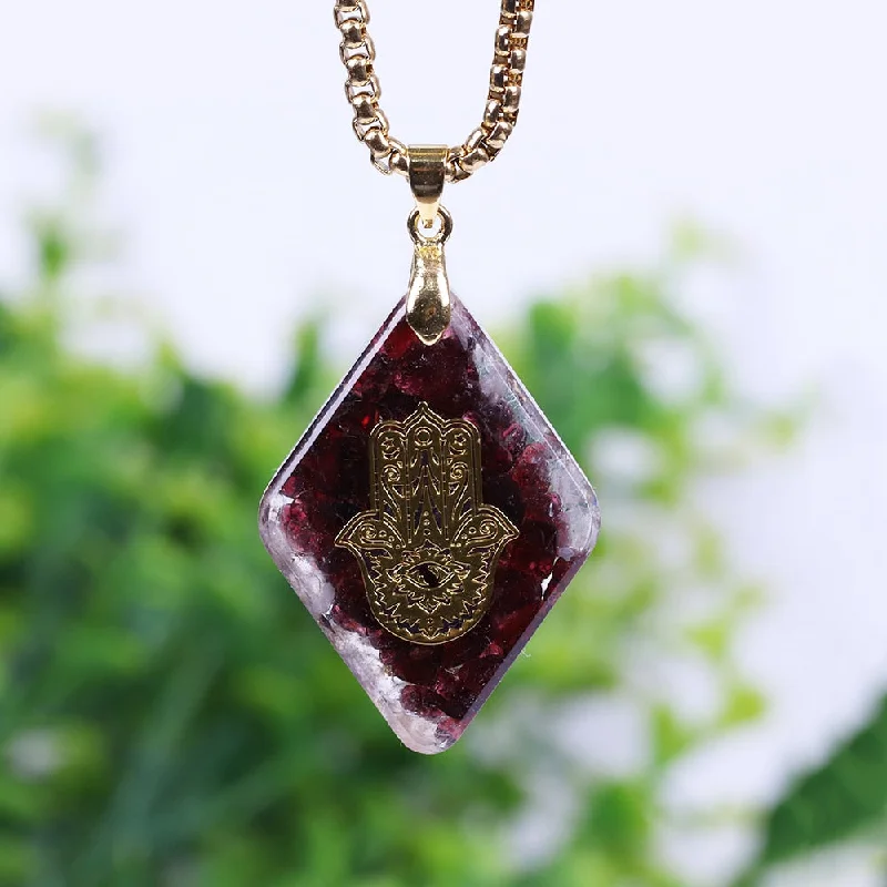 Necklaces and pendants with star-shaped designs for a whimsical, celestial touch-Garnet Hand Of Hamsa Orgone Necklace